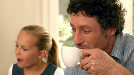 Cute-father-having-coffee