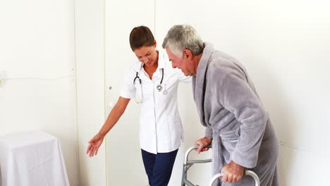 -Nurse-helping-senior-man-to-walk