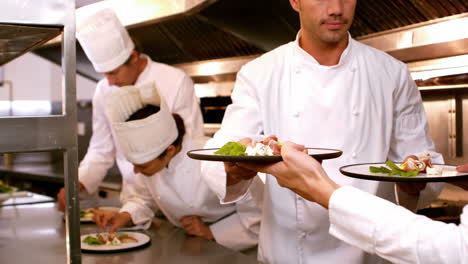 Chef-handing-over-plates