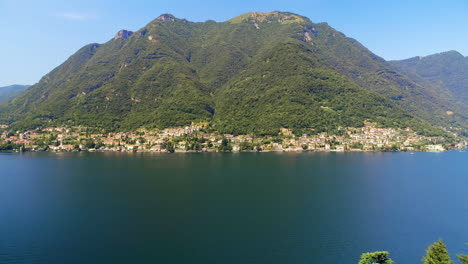 Green-lush-mountain-and-lake-on-a-sunny-day-4k