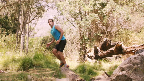 Hiker-jumping-across-stream