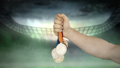 Hand-is-throwing-medals