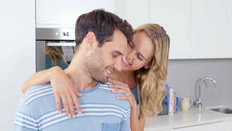 Cute-couple-embracing-and-preparing-the-meal
