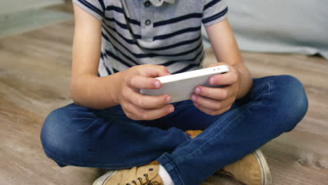 A-boy-playing-games-on-smartphone
