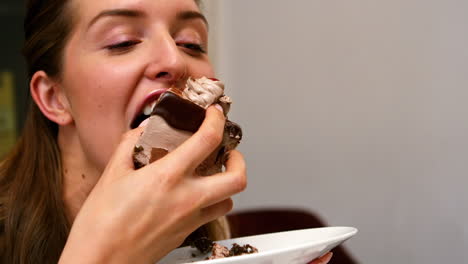 Woman-eating-a-piece-of-cake