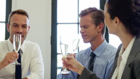 Business-people-toasting-with-champagne