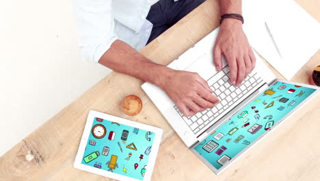 Man-using-laptop-and-digital-tablet-with-futuristic-icons