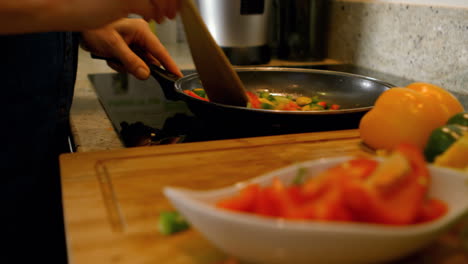 Woman-cooking-vegetables