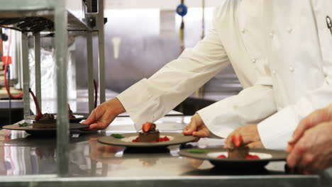 Chefs-putting-finishing-touch-on-desserts