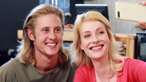 Smiling-couple-taking-a-selfie