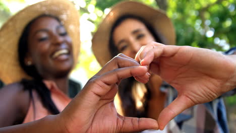 Young-hipsters-are-doing-a-heart-with-their-hands-