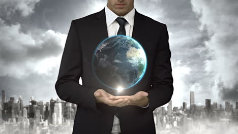Businessman-holding-digital-generated-globe