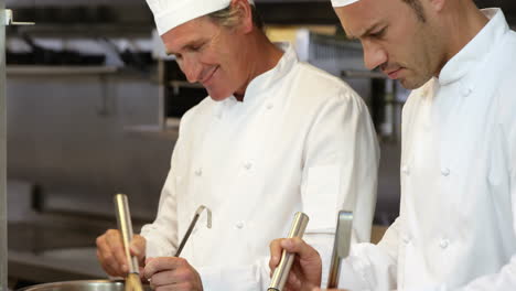 Two-chef-preparing-a-meal