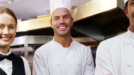 Restaurant-team-posing-together-smiling-at-camera