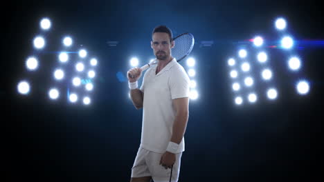 Portrait-of-young-man-standing-with-the-racket