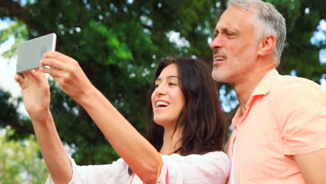 Smiling-couple-taking-selfie-