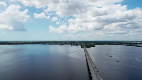 High-elevation-drone-shot-looking-down-at-the-bridge-from-Fort-Myers-to-Cape-Coral