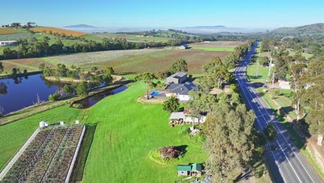 Aerial-descending-over-farm-buildings-at-a-vineyard-in-the-Yarra-Valley-near-Yarra-Glen-Victoria-Australia