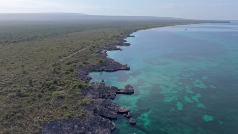Aerial-flyover-Cabo-Rojo-Coastline-with-coral-reef-in-water-and-rocky-coast