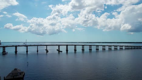 Drone-aerial-shot-of-the-Fort-Myers-Beach-bridge-on-a-busy-day