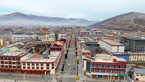 Slow-motion-aerial-rising-shot-of-the-beautiful-architecture-at-Sertar-City,-China