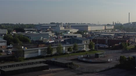 Aerial-view-descending-into-huge-warehouse-distribution-business-park-complex