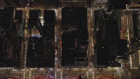 NYC-New-York-Aerial-v312-vertical-top-down-view,-drone-flyover-E-44th-St-capturing-Midtown-Manhattan-night-cityscape-and-Grand-Central-station-from-above---Shot-with-Inspire-3-8k---September-2023
