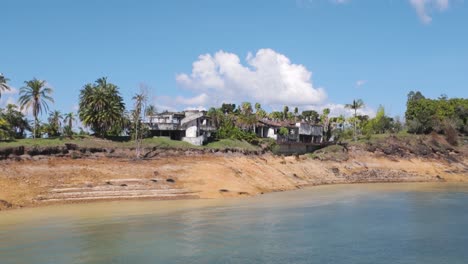 Ruined-Escobar-mansion-"La-Manuela"-in-Colombia-surrounded-by-lush-greenery-and-calm-water