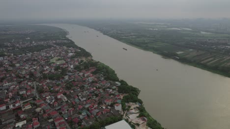 Aerial-Drone-Flyover-Red-River-Shipping-Route,-Hanoi,-Vietnam