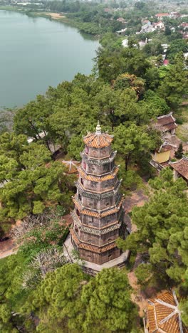 Aerial-View-of-Thien-Mu-Pagoda-in-Hue,-Vietnam-in-vertical-video