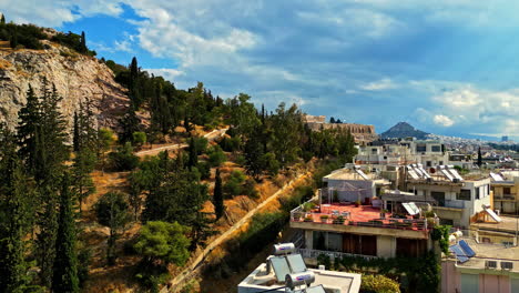 Acropolis-Hill-and-Athens-Cityscape-at-Sunset-in-Aerial-Pedestal-up-View