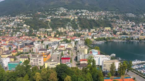 Aerial-Drone-View-of-Scenic-Locarno-Town-with-Colorful-Buildings-and-Water-in-Switzerland