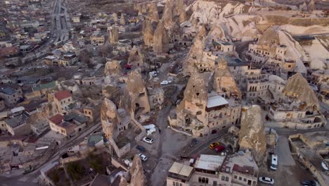 Aerial-View-of-Goreme-Turkey,:-Scenic-Town-Nestled-in-the-Heart-of-Cappadocia's-Unique-Rock-Formations---Fairy-Chimney-Houses-in-Vast-Desert-Landscape