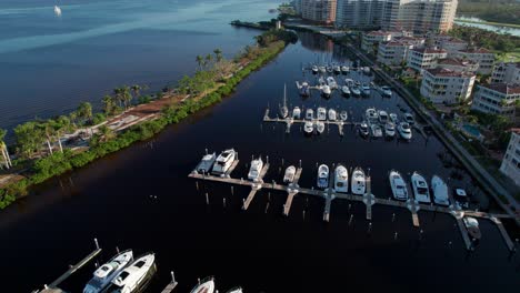 Drone-aerial-shot-of-large-boats-in-a-harbor-in-Florida-on-a-sunny-morning