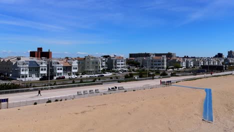 An-aerial-view-of-the-boardwalk-in-Far-Rockaway,-Queens-on-a-sunny-day