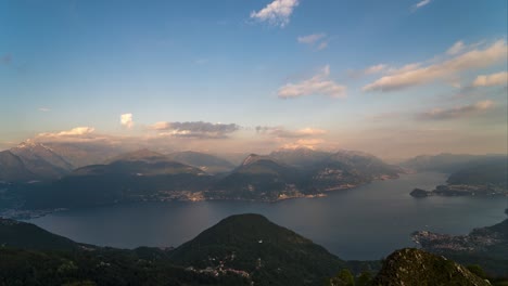 Day-to-night-time-lapse-from-mountain-top-looking-over-Lake-Como,-Italy