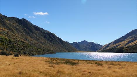 Panning,-scenic-view-of-Moke-Lake-in-a-valley-by-Queenstown,-South-Island,-New-Zealand