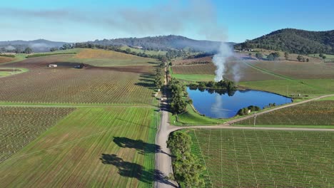 Overhead-Pinnacle-Lane-in-the-Yarra-Valley-near-Yarra-Glen-with-burn-off-dam-and-hills-beyond