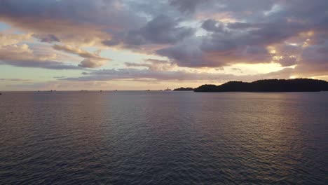 unset-over-the-mountains-and-ocean-with-ships