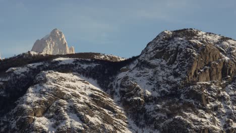 Zoom-out-perspective-of-rocky-and-frozen-Mount-Fitz-Roy-in-Patagonia,-Argentina