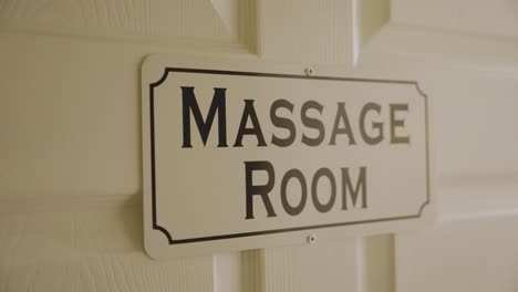 The-door-of-the-room-at-the-massage-center-is-labeled-"Massage-Room