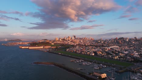 Wide-angle-drone-shot-of-San-Francisco,-California-during-a-beautiful-sunset