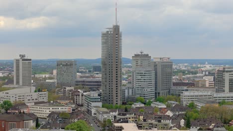 Tilt-up-drone-shot-of-Essen-city-in-Germany-with-clear-sky-in-the-morning