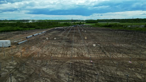 Aerial-view-of-support-structures-like-mounting-racks,-ready-to-hold-panels-in-solar-farm