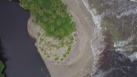 Drone-overhead-shot-of-river-meeting-the-ocean