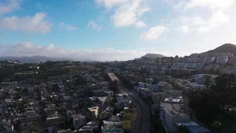 Drone-aerial-view-of-homes-and-apartments-in-the-hills-of-San-Francisco,-CA