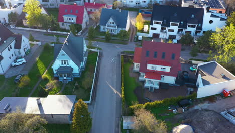 Residential-area-houses-in-aerial-view-on-golden-hour-sunlight