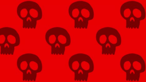 Large-Black-Halloween-Skulls-pan-left-on-red-background
