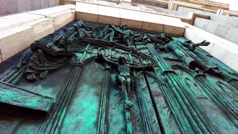 close-up-of-jesus-christ-depicted-on-bronze-church-door-of-Catedral-De-La-Almudena-in-Madrid