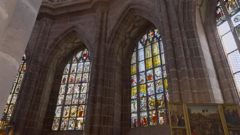 Panning-view-of-huge-stained-glass-windows-in-a-German-church